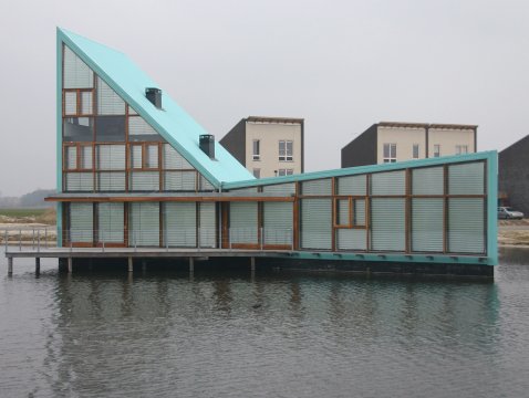 Panel glide system with pleated sun protection film