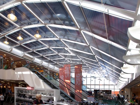 electrical opposite pull blinds with film hangings under horizontal glass roof 